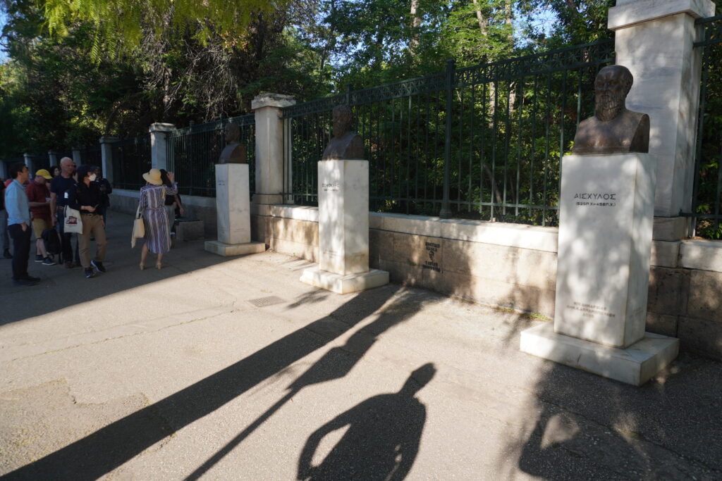 Pause at the statues of the three Greek tragedians (Sophocles, Aeschylus, and Euripides) outside the National Garden