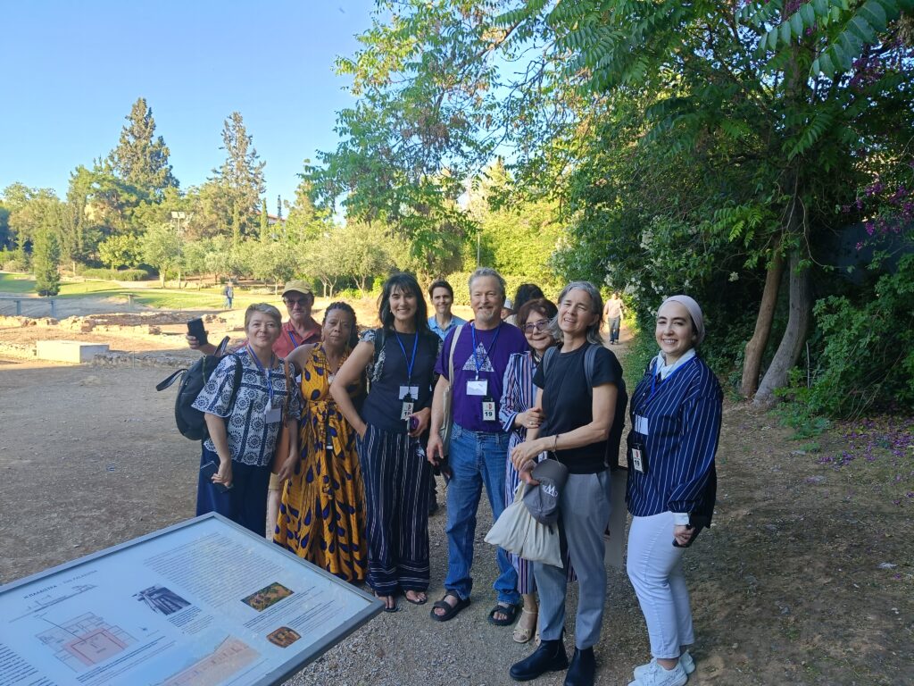 Conference participants in a group photo inside Aristotle’s Lyceum